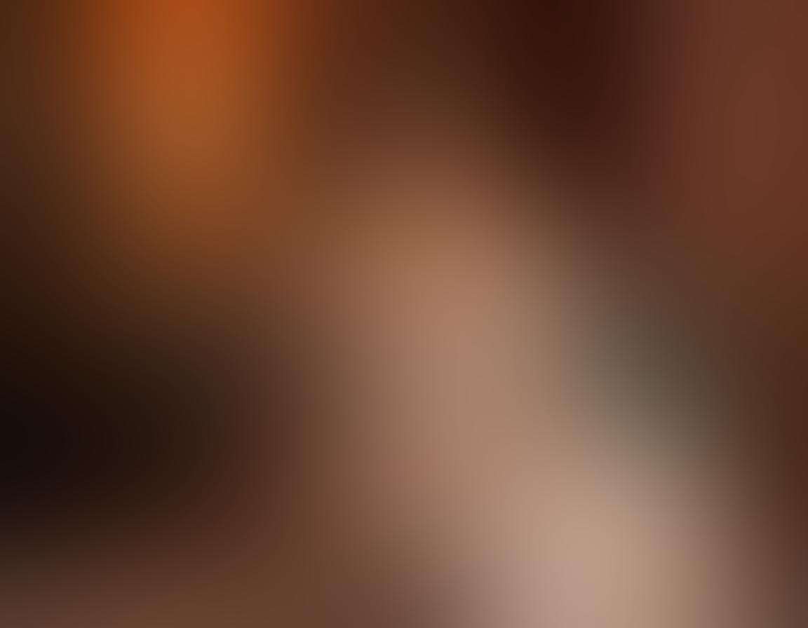 A stunning plus-size model with confident body language, elegantly posed in an artistic setting filled with soft lighting, ornate fabrics, and subtle floral accents. Highlight the beauty of diverse curves through tasteful hints of sensuality and allure, with a dreamy background that enhances the mood. The scene should evoke feelings of empowerment and celebration of body positivity. vivid colors. ethereal atmosphere. soft focus.